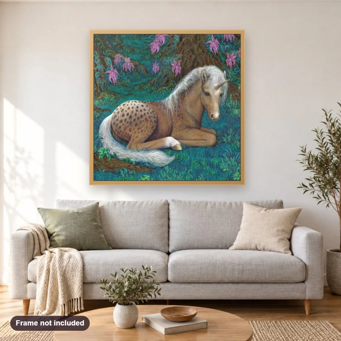 Cute Unicorn Baby diamond painting shown framed on a living room wall above a sofa