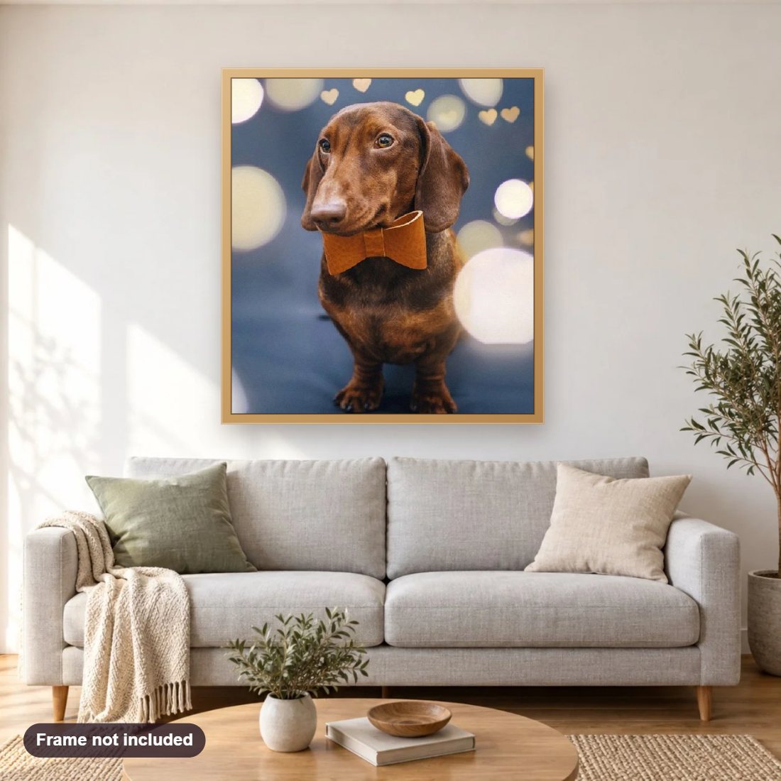 Dachshund with a Bow Tie diamond painting shown framed on a living room wall above a sofa