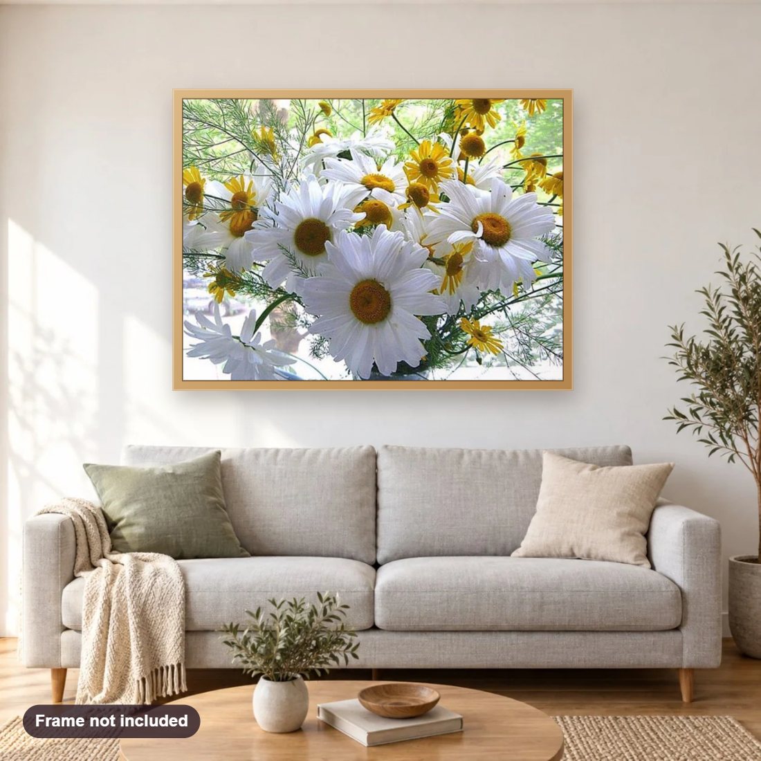 Daisy diamond painting shown framed on a living room wall above a sofa