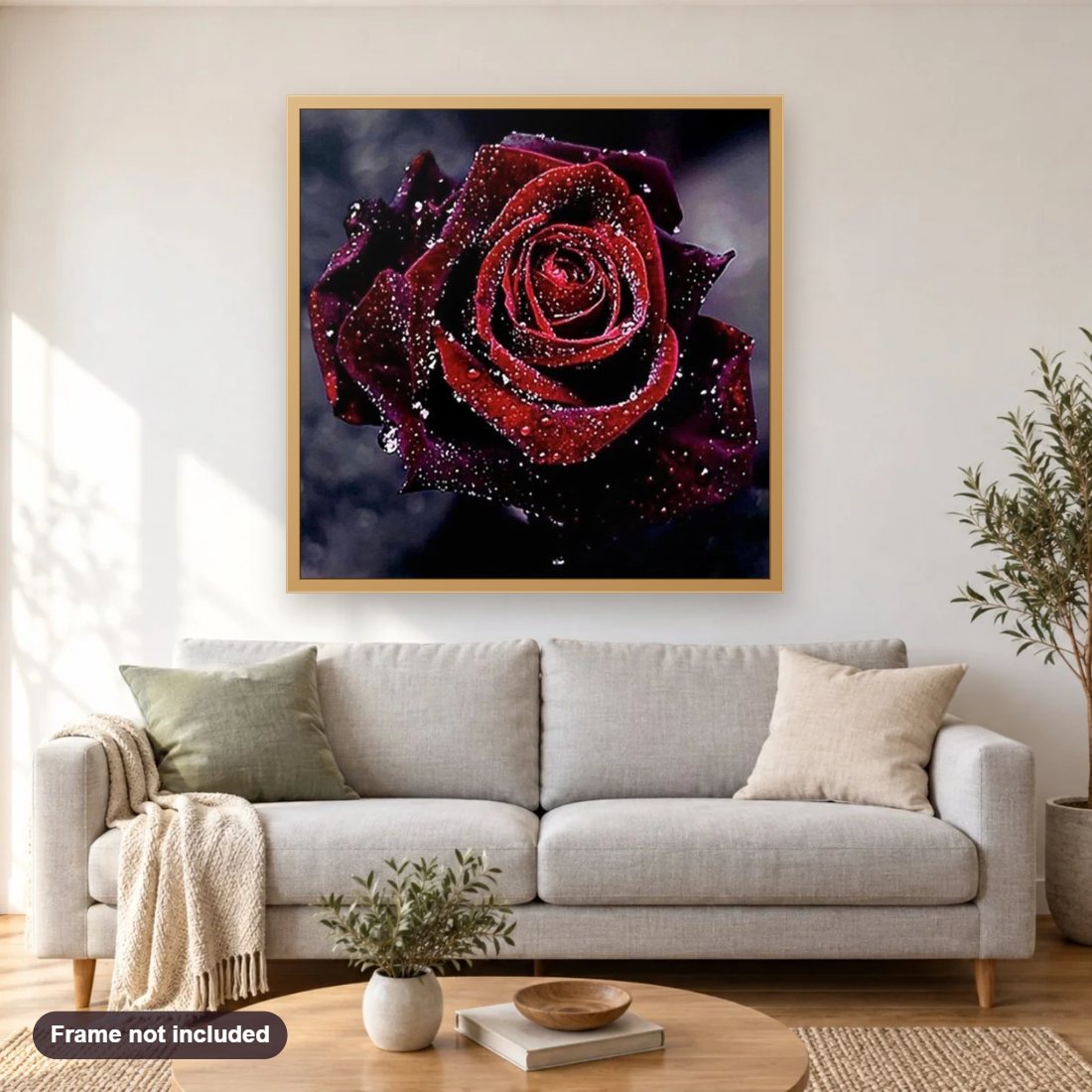 Dark Red Rose with Water Drops diamond painting shown framed on a living room wall above a sofa