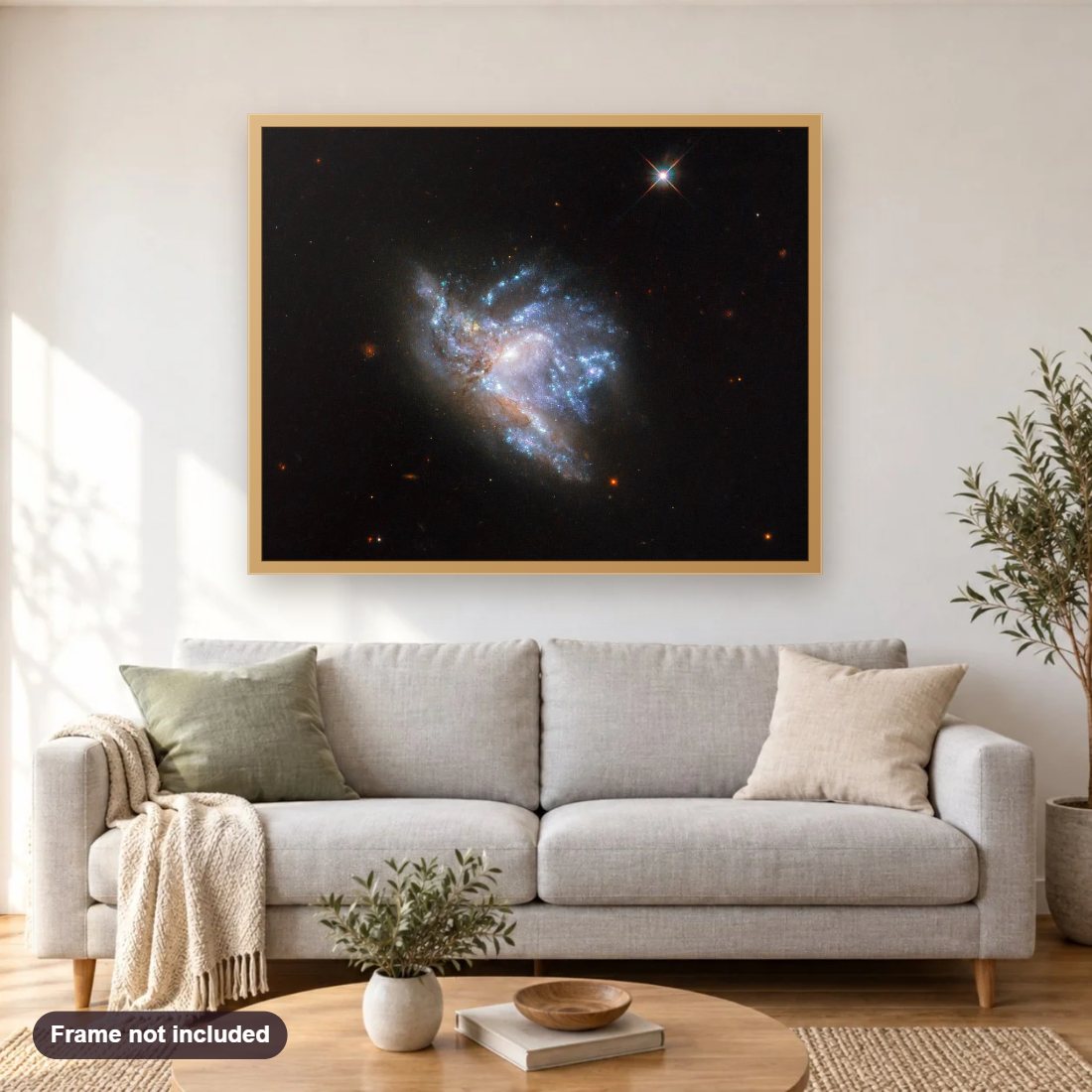Dazzling Colliding Galaxies diamond painting shown framed on a living room wall above a sofa