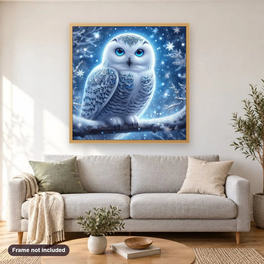 Dazzling Owl in Icy Night diamond painting shown framed on a living room wall above a sofa