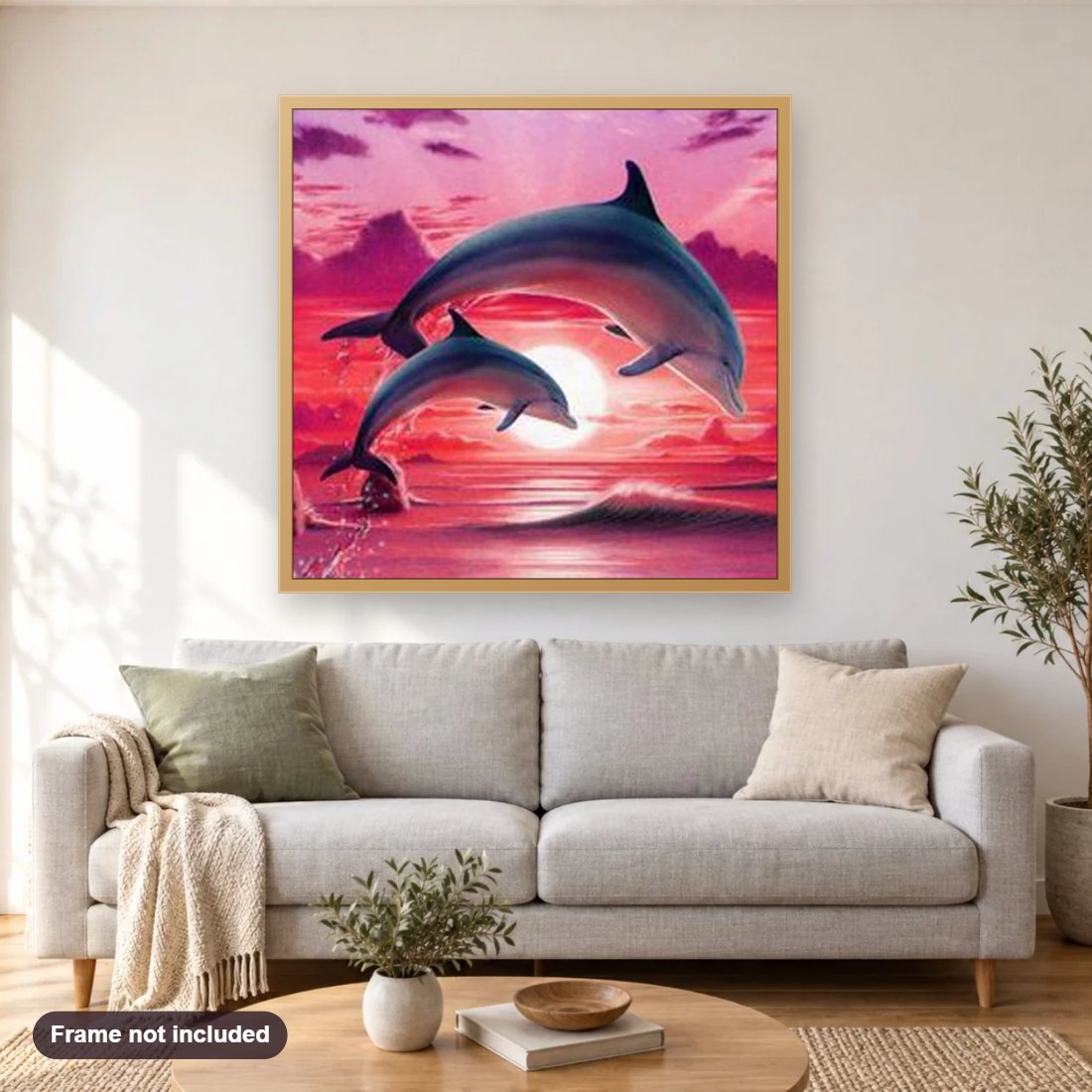 Dolphins Pair diamond painting shown framed on a living room wall above a sofa