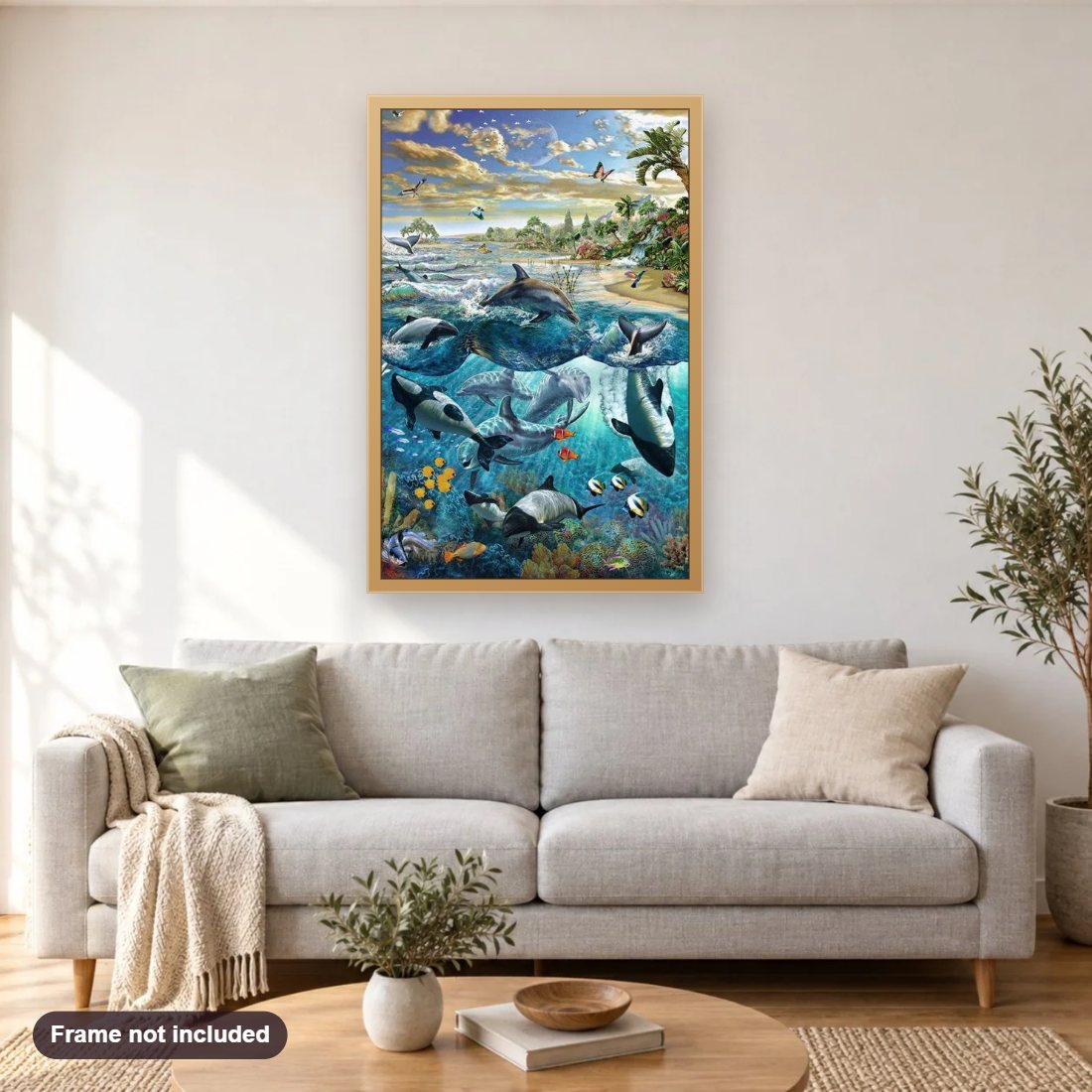 Dolphins & Whales diamond painting shown framed on a living room wall above a sofa