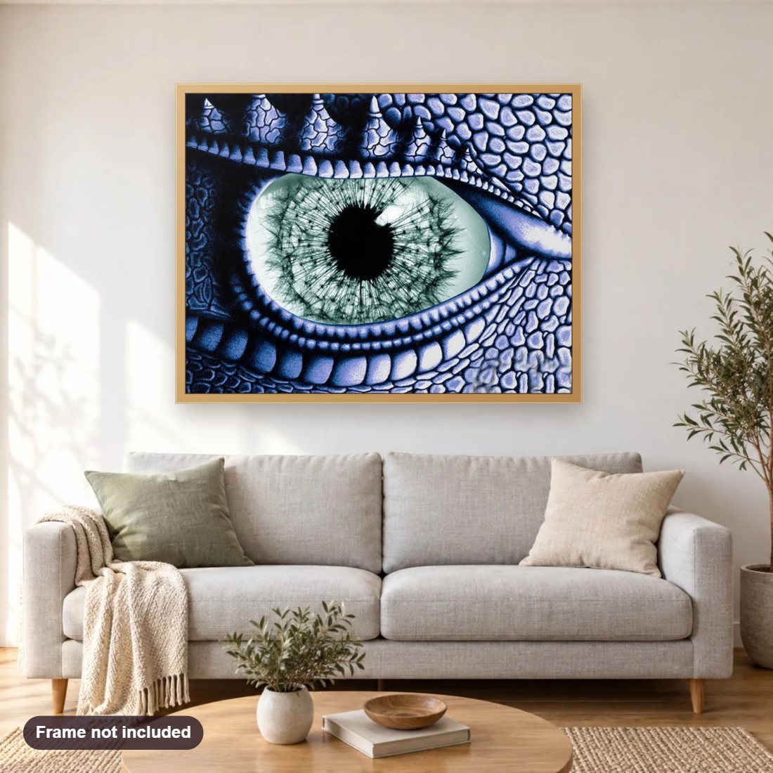 Dragon Eye diamond painting shown framed on a living room wall above a sofa