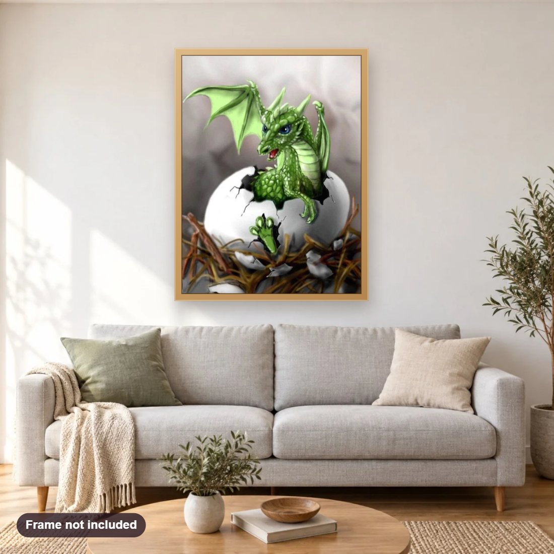 Dragon Hatching diamond painting shown framed on a living room wall above a sofa