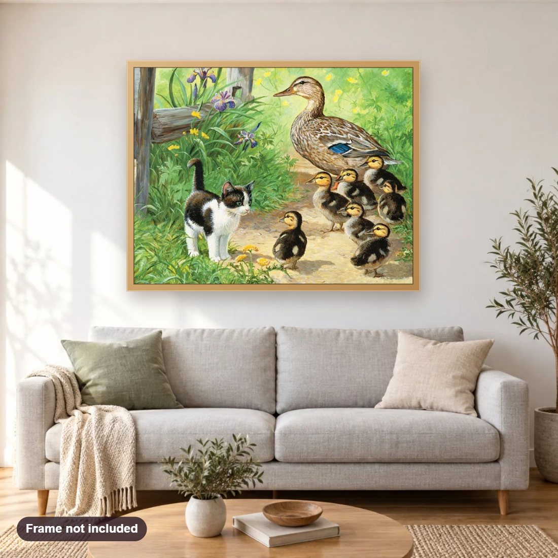 Duck Family & Kitten diamond painting shown framed on a living room wall above a sofa