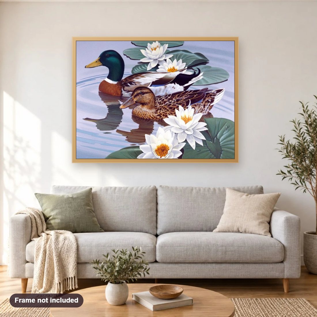 Ducks Pair & White Lotus diamond painting shown framed on a living room wall above a sofa