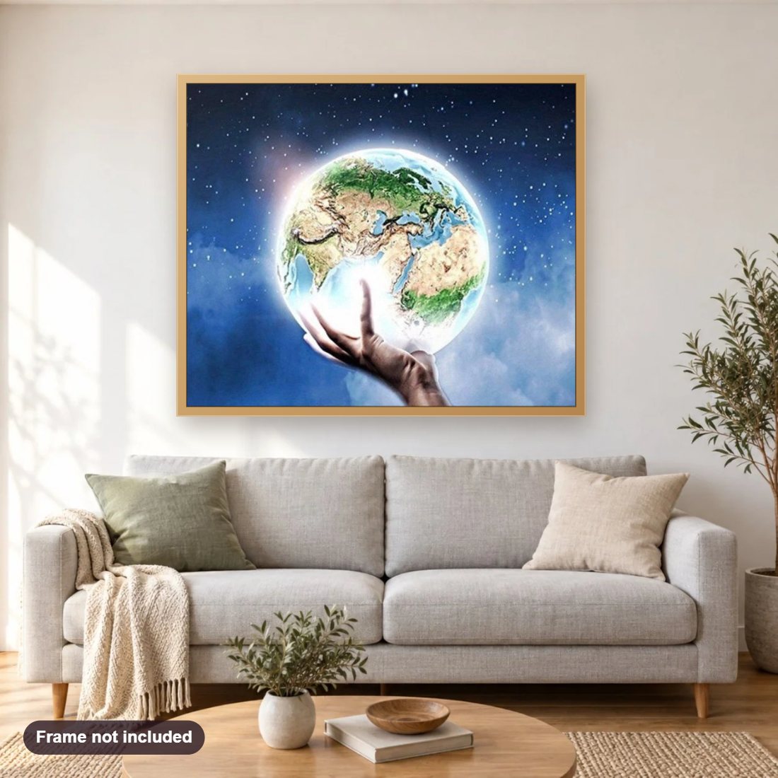 Earth & Universe diamond painting shown framed on a living room wall above a sofa