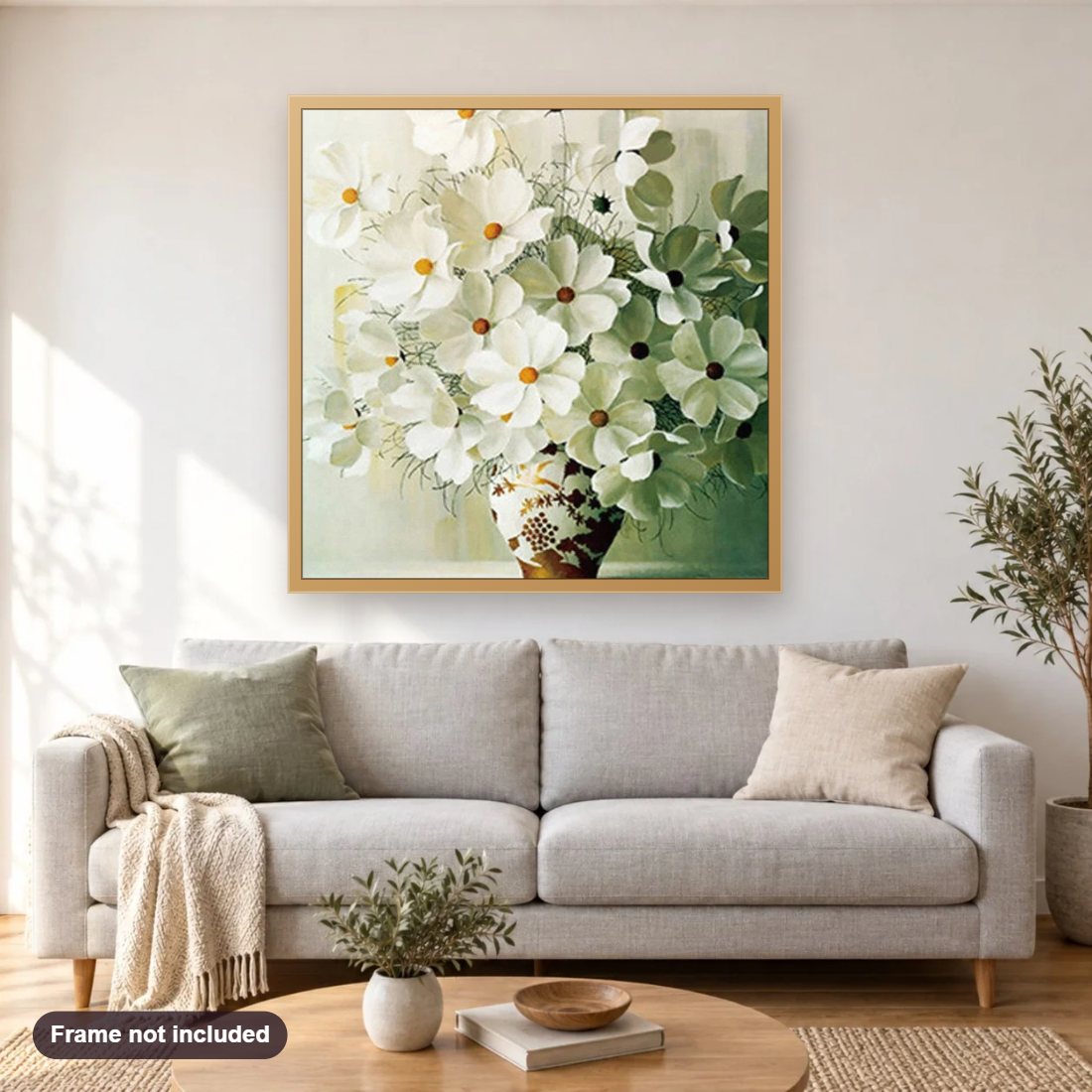 Elegant White Flowers in Vase diamond painting shown framed on a living room wall above a sofa