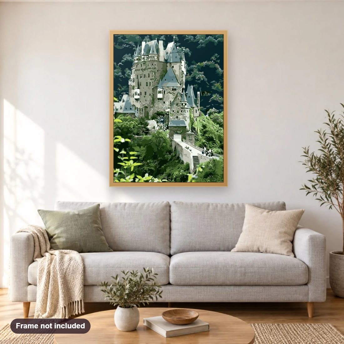 Eltz Castle diamond painting shown framed on a living room wall above a sofa