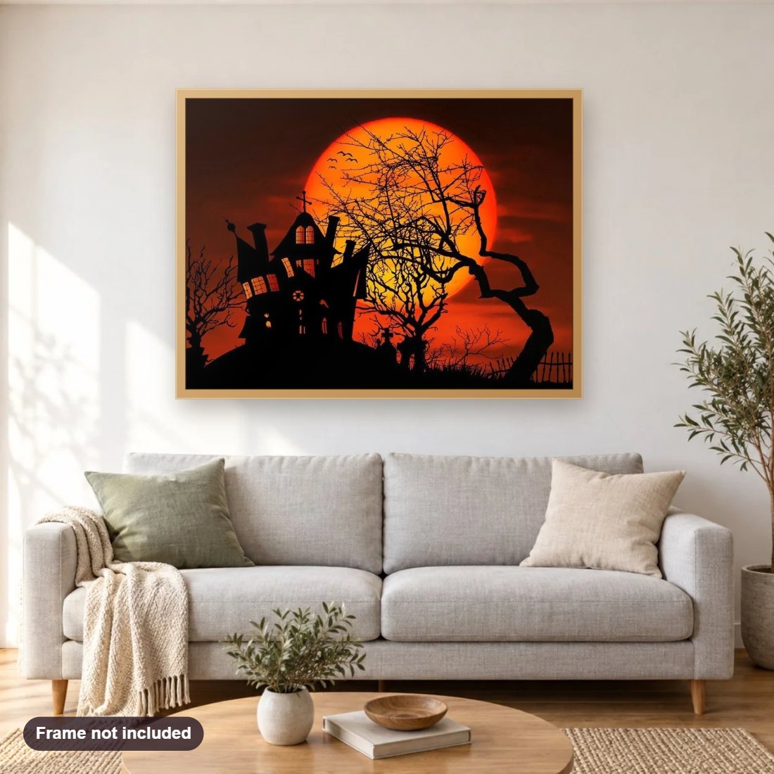 Enchanted Halloween House diamond painting shown framed on a living room wall above a sofa