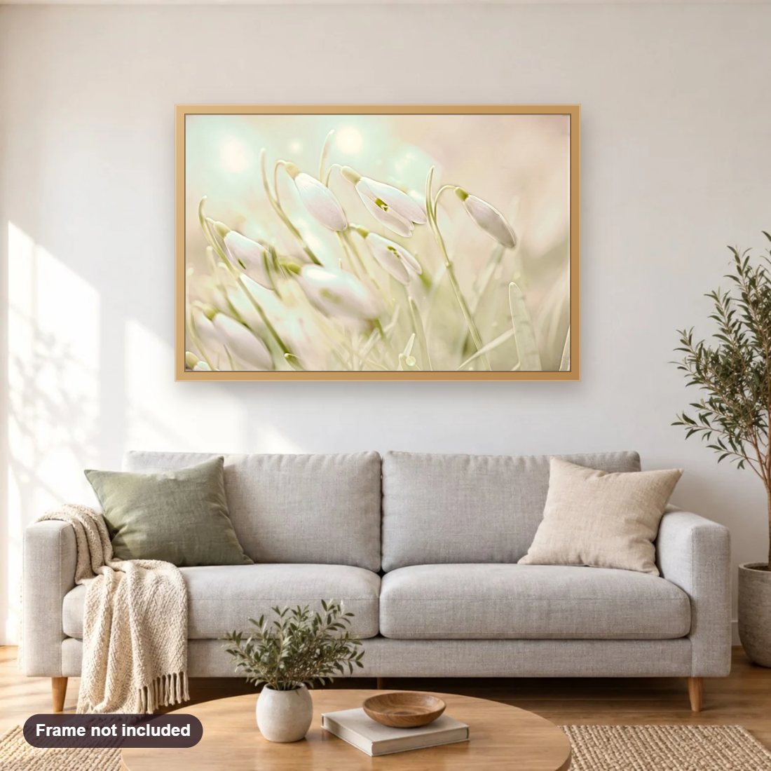 Enchanting Sanowdrops diamond painting shown framed on a living room wall above a sofa