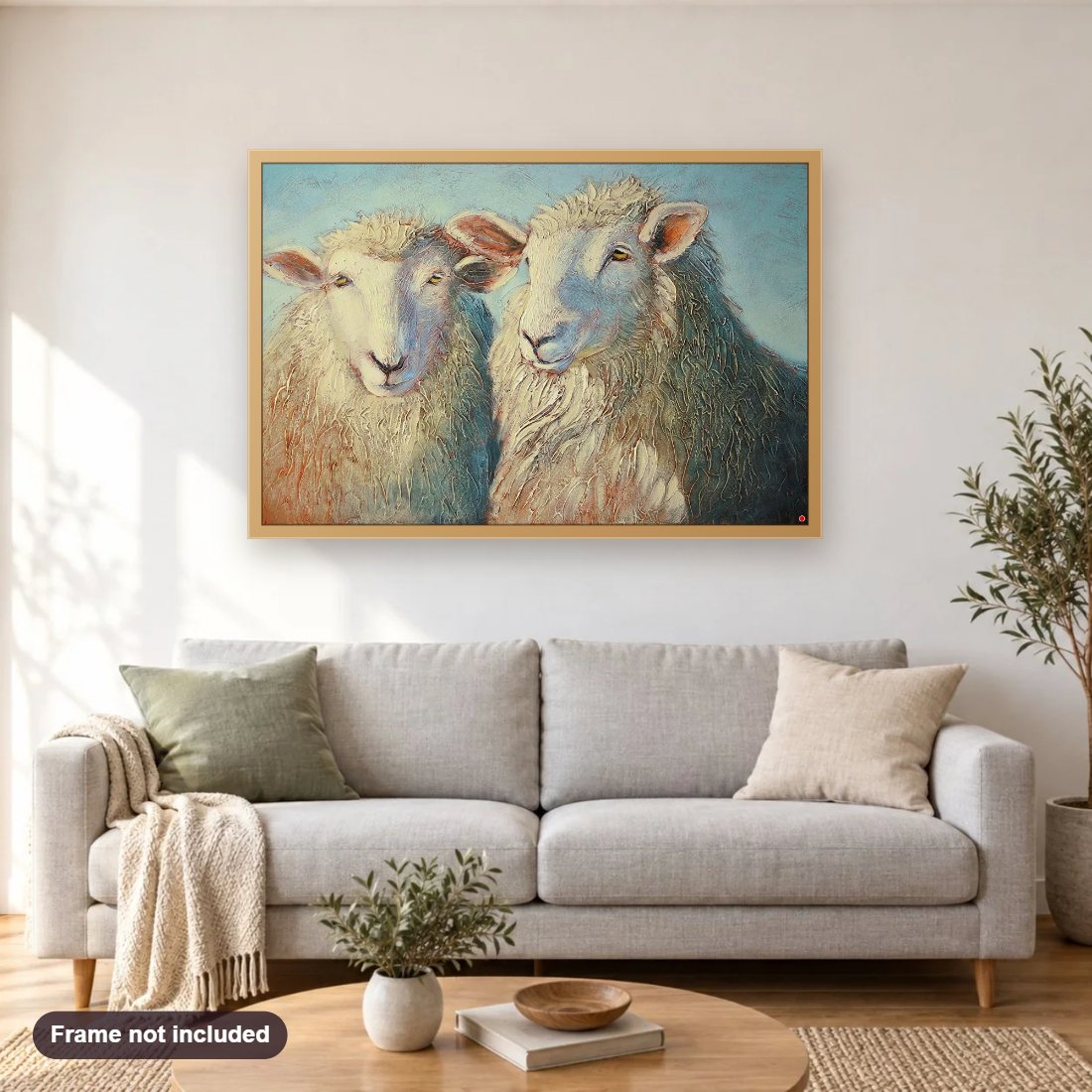 Ewe’ll Thread Softly diamond painting shown framed on a living room wall above a sofa