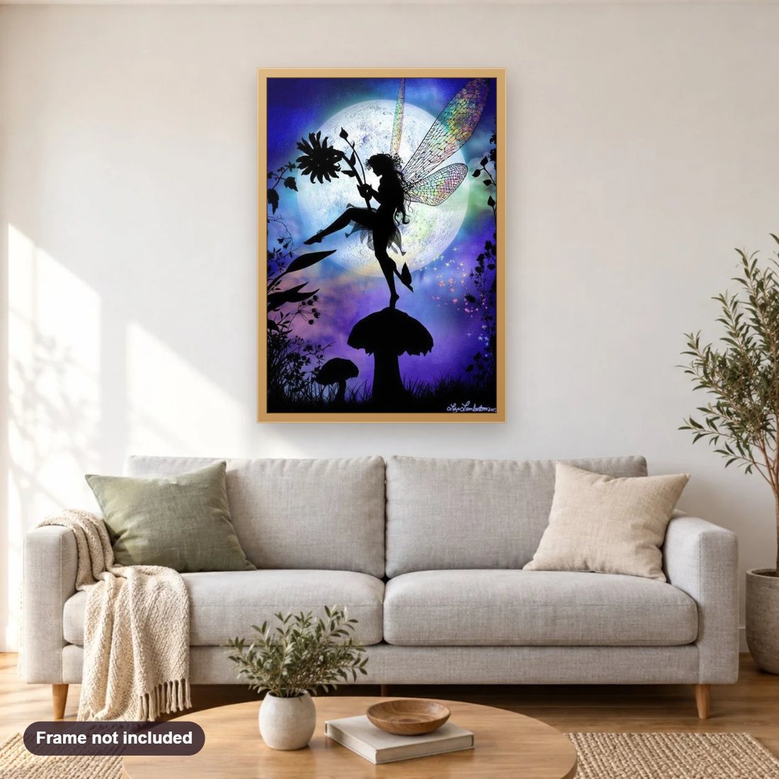 Fairy in the Forest diamond painting shown framed on a living room wall above a sofa