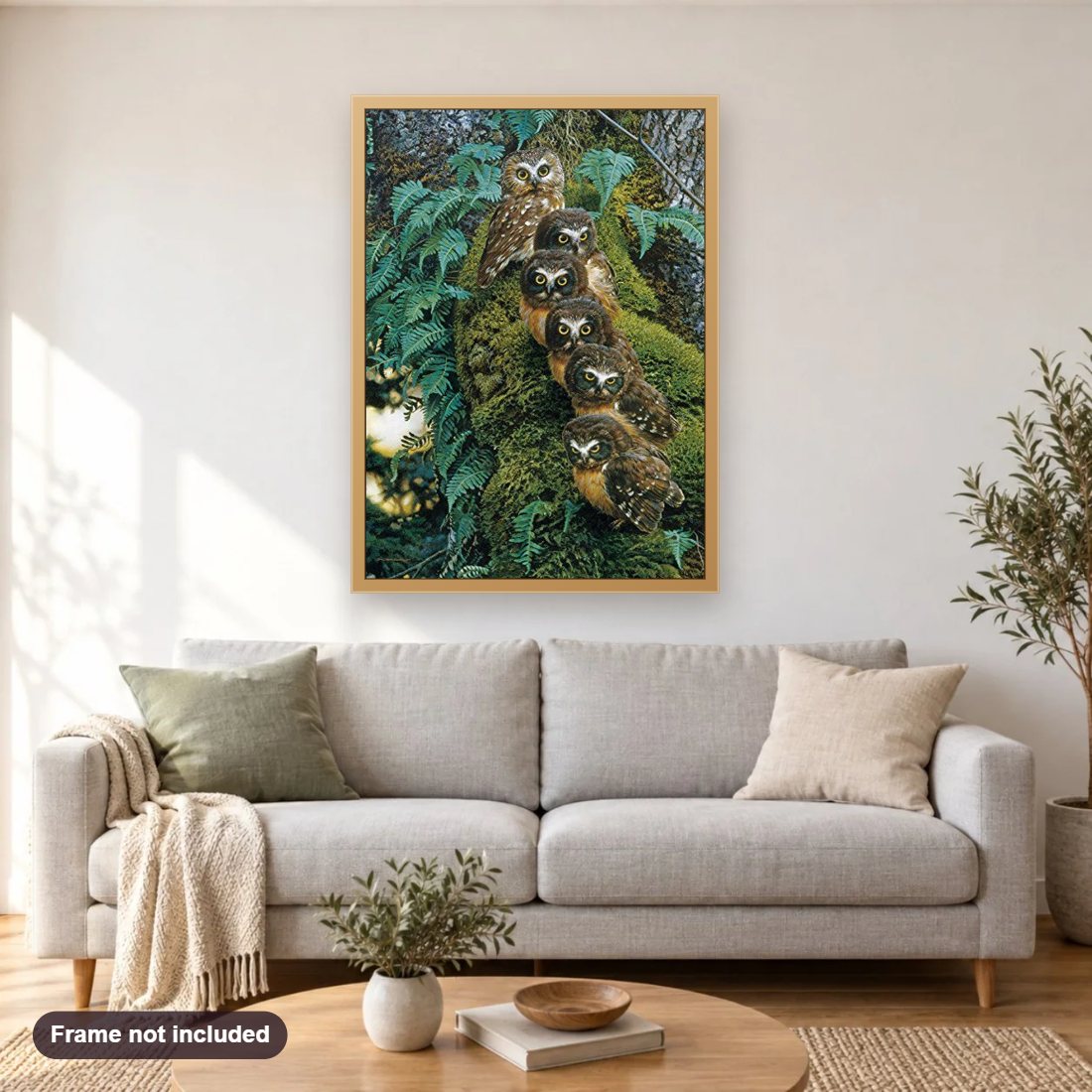 Family of Owls on the Tree diamond painting shown framed on a living room wall above a sofa