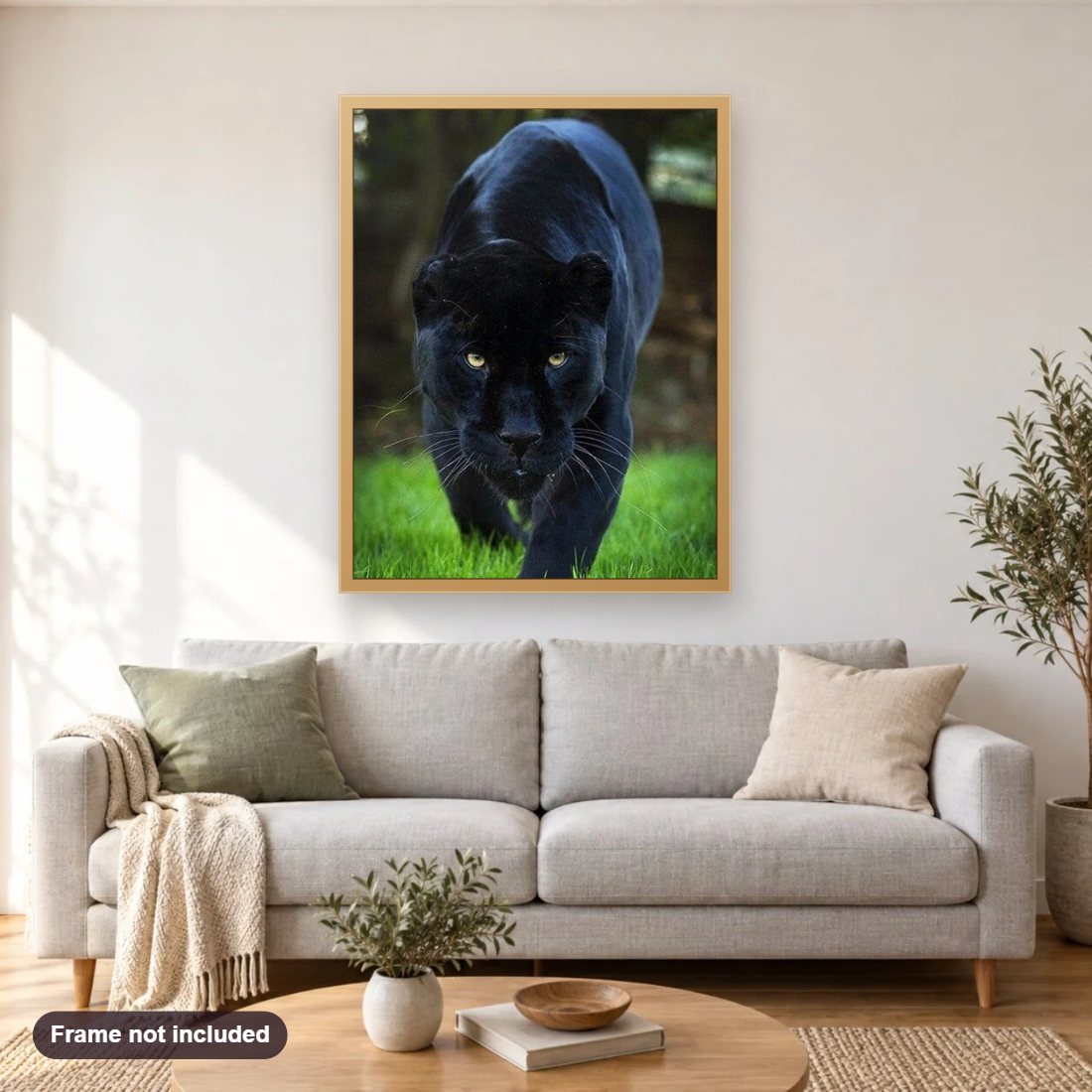 Ferocious Panther Walking on Grass diamond painting shown framed on a living room wall above a sofa