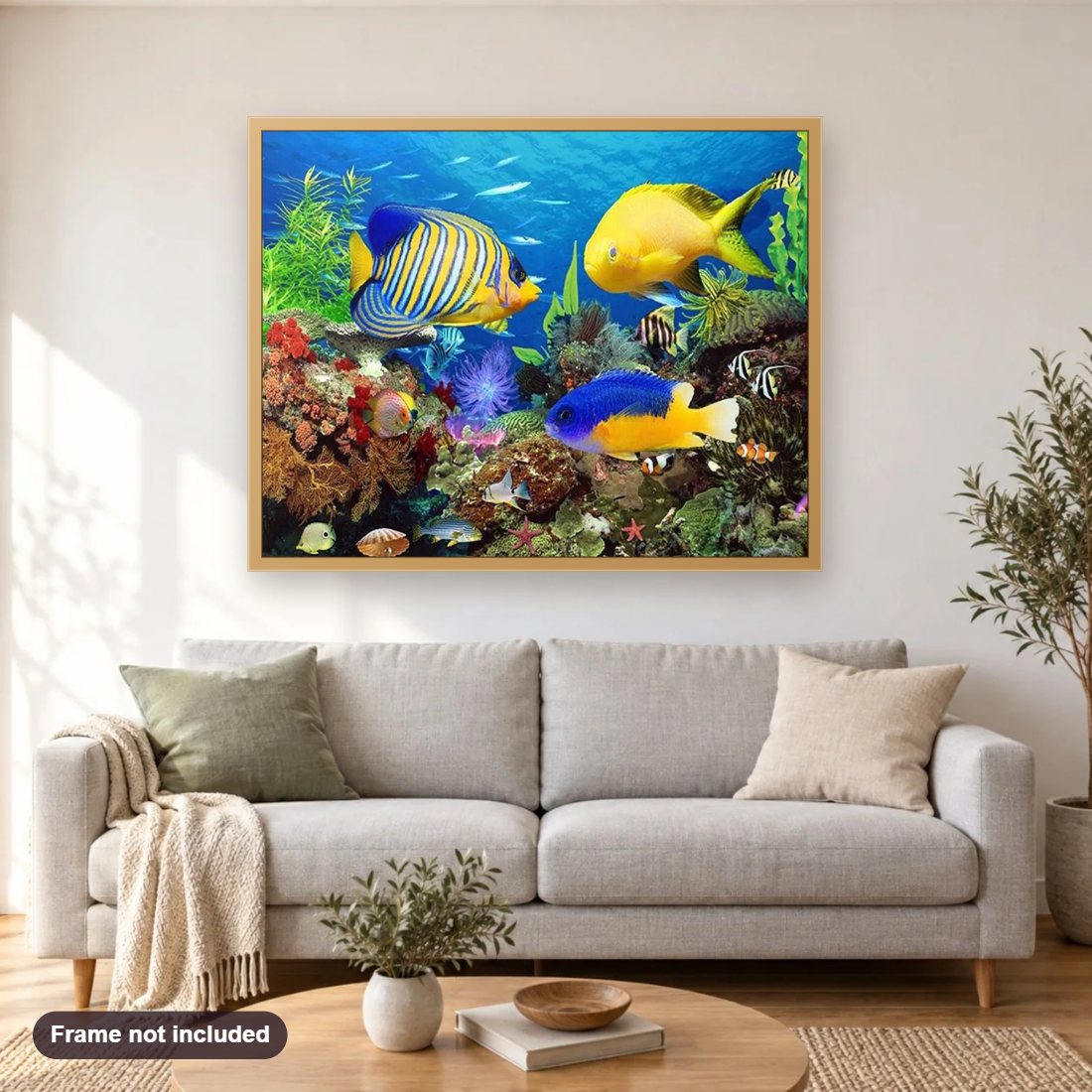 Fish Aquarium diamond painting shown framed on a living room wall above a sofa
