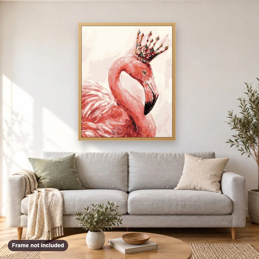 Flamingo King diamond painting shown framed on a living room wall above a sofa