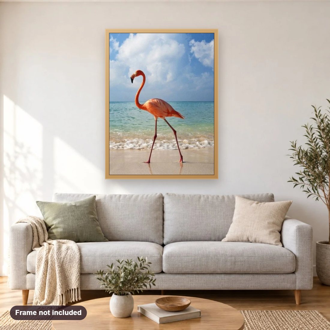 Flamingo on the Beach diamond painting shown framed on a living room wall above a sofa