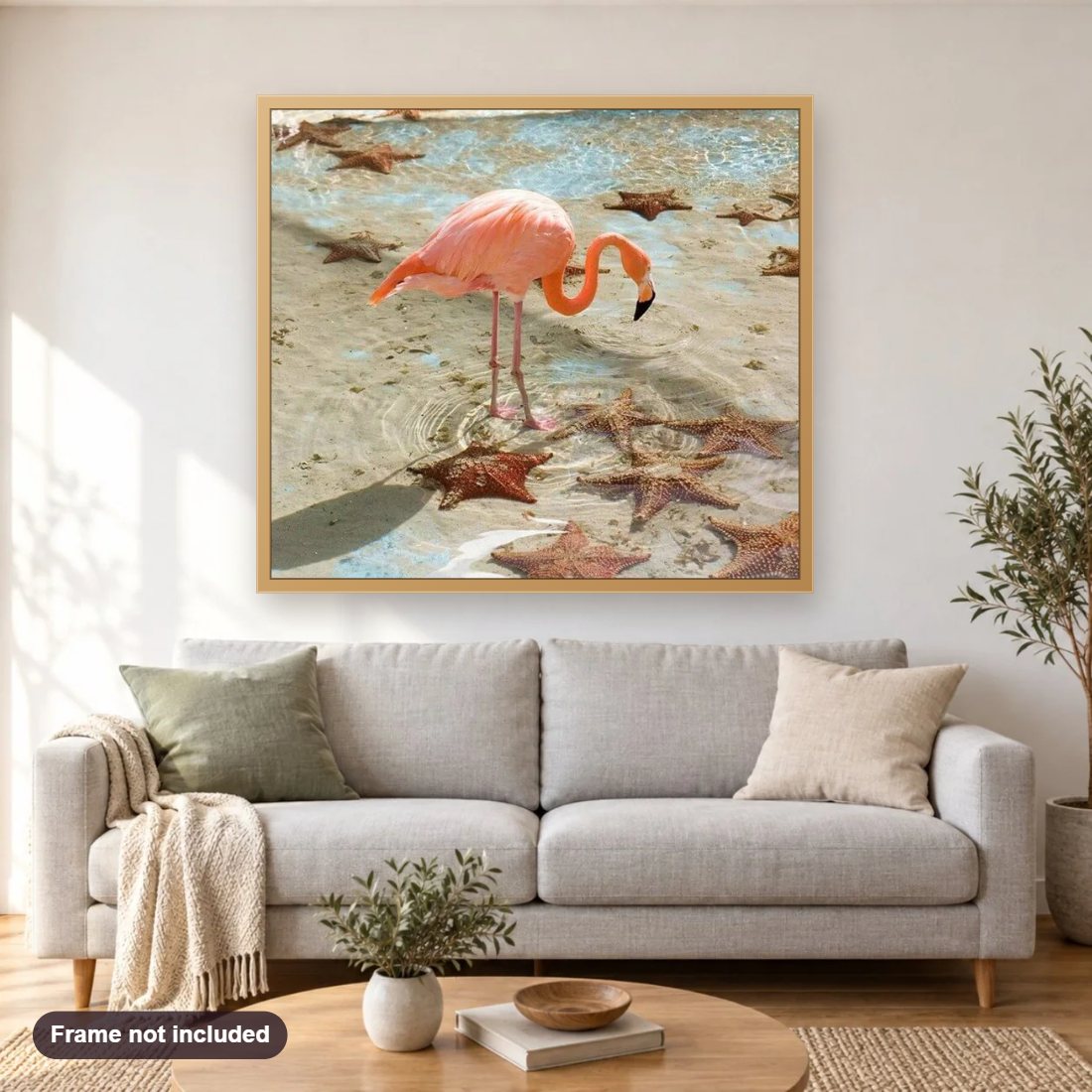Flamingo & Star Fish diamond painting shown framed on a living room wall above a sofa