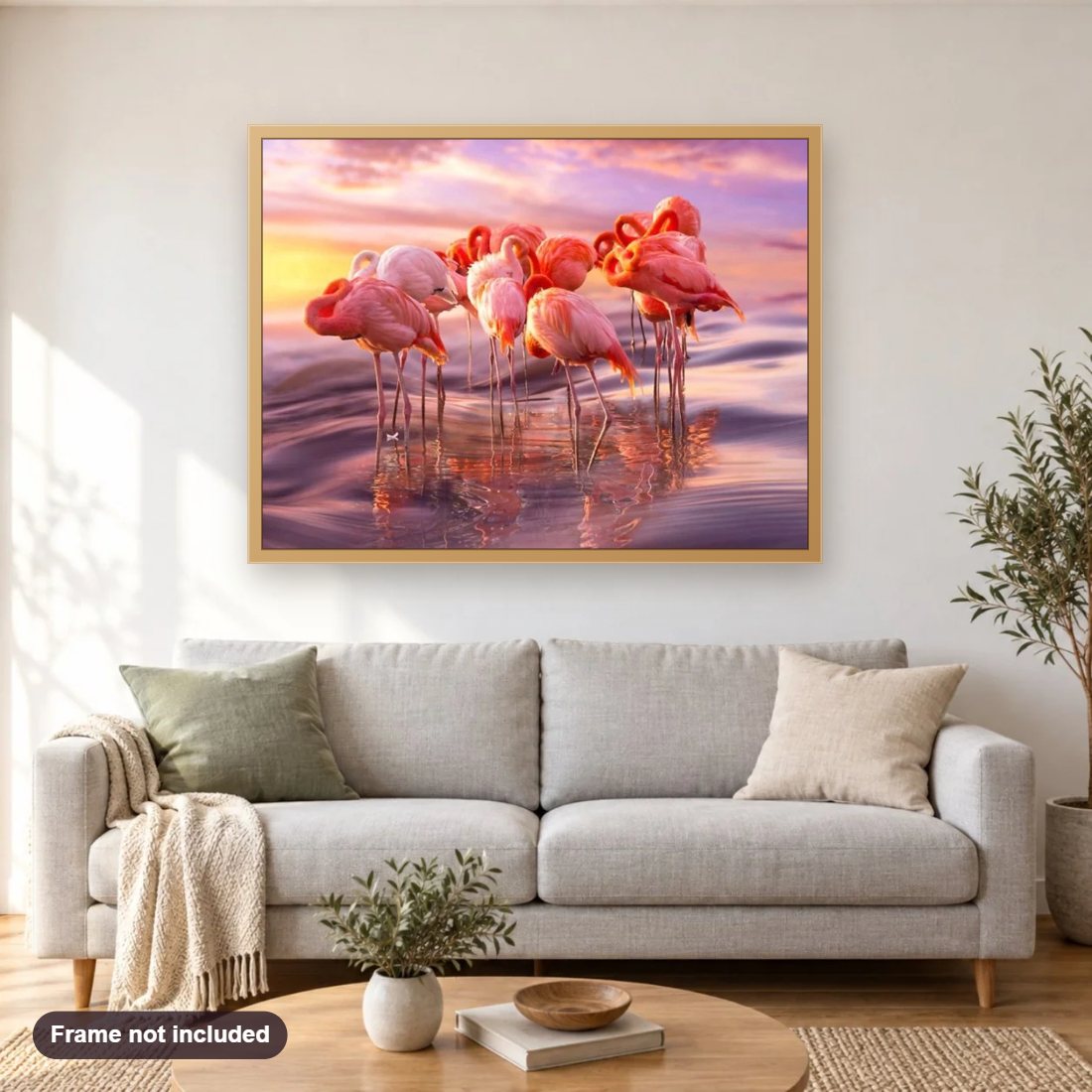 Flamingos Group diamond painting shown framed on a living room wall above a sofa