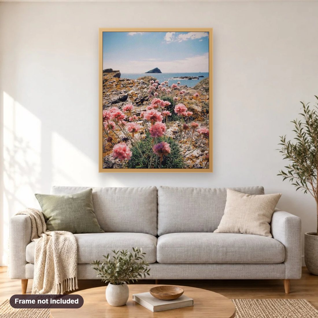 Flowers by the Ocean diamond painting shown framed on a living room wall above a sofa