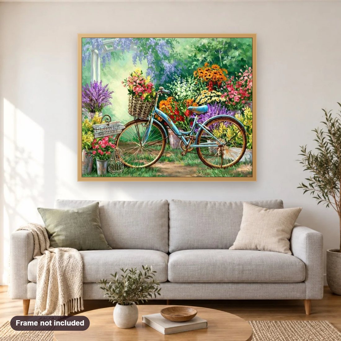 Flowers Market & Bicycle diamond painting shown framed on a living room wall above a sofa