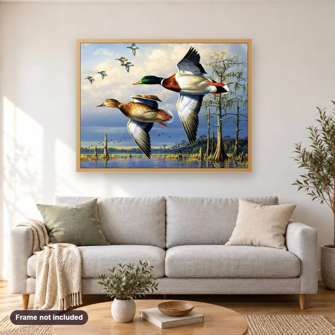 Flying Ducks diamond painting shown framed on a living room wall above a sofa