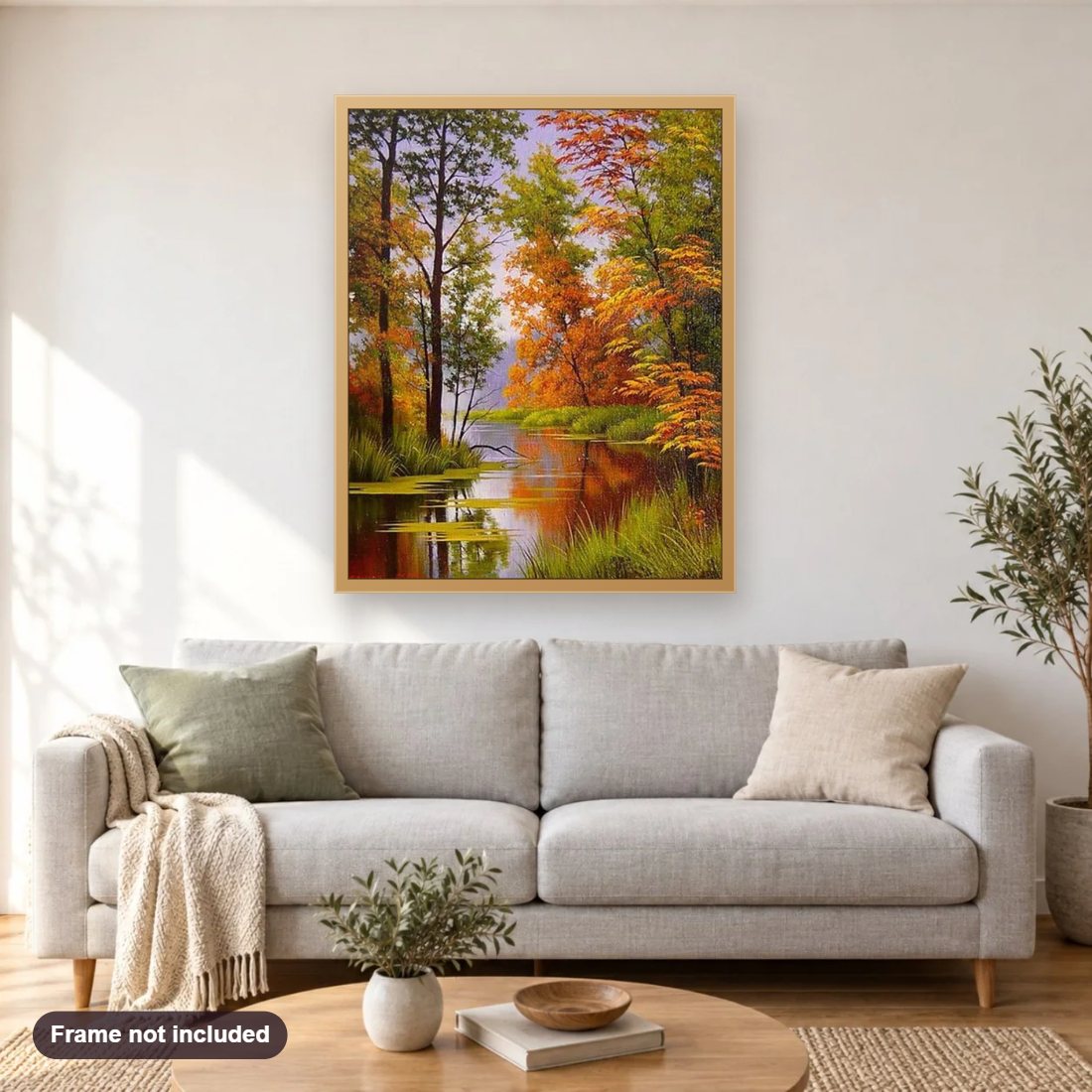 Forest by the Lake diamond painting shown framed on a living room wall above a sofa