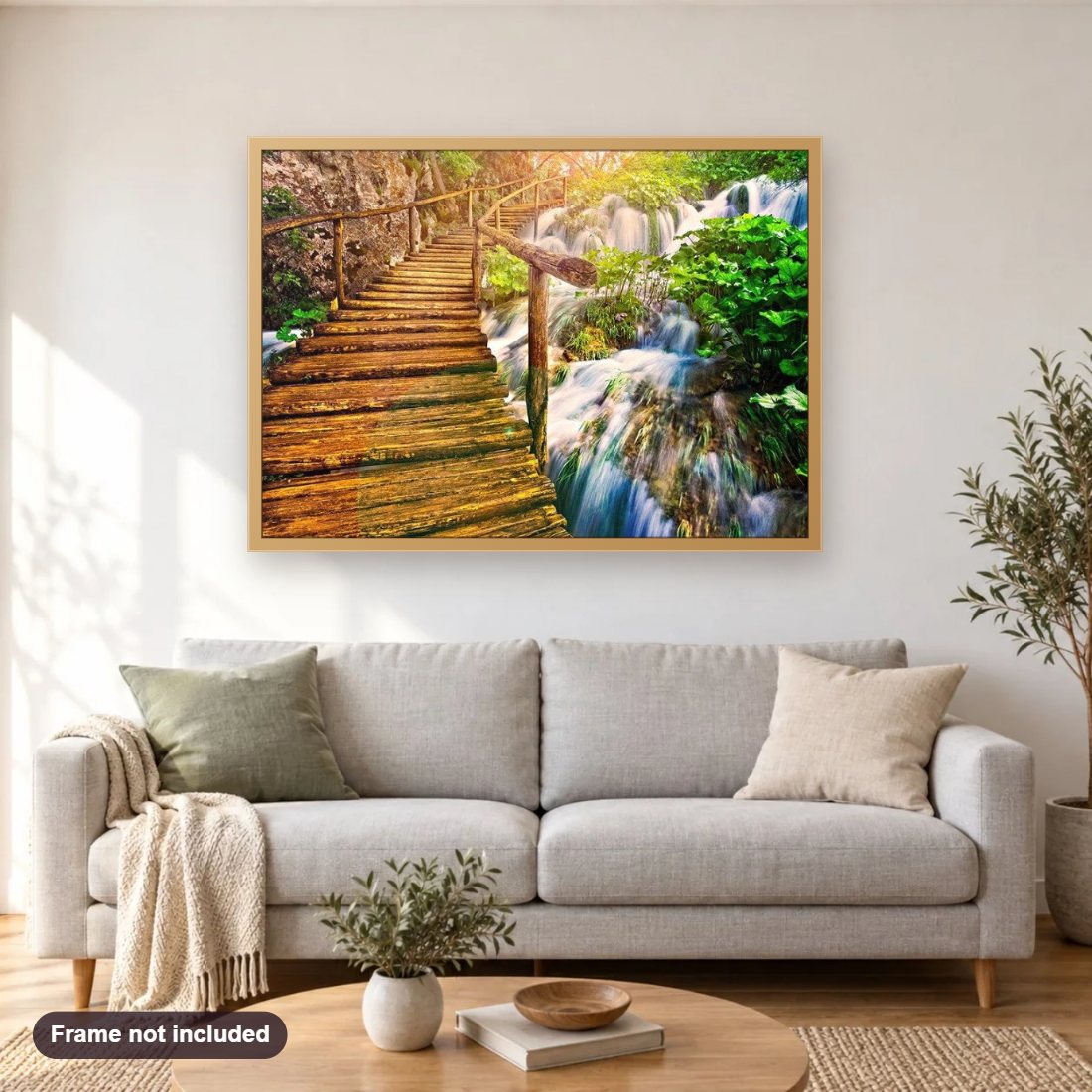 Forest Waterfall diamond painting shown framed on a living room wall above a sofa