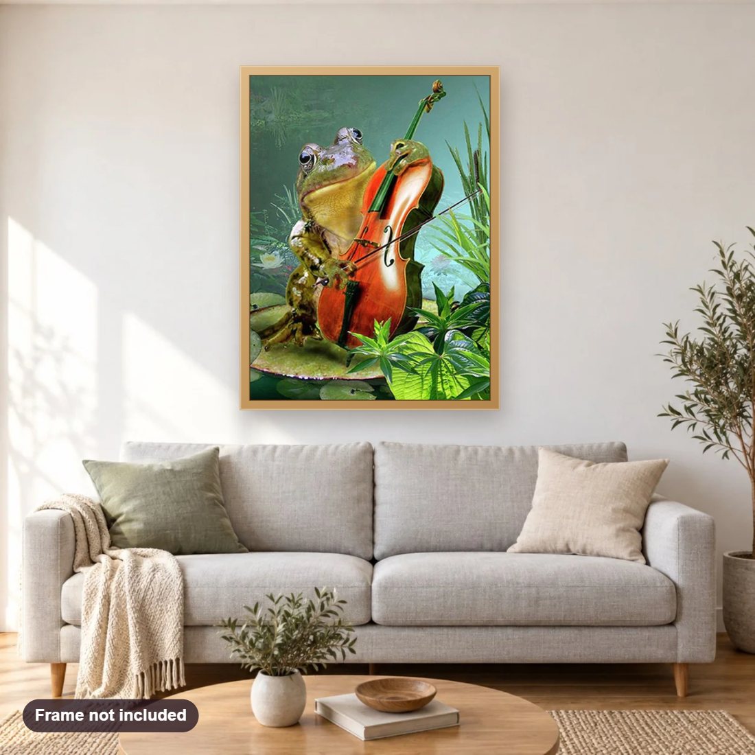 Frog Playing Guitar diamond painting shown framed on a living room wall above a sofa