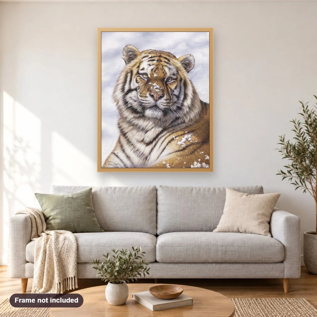 Frosty diamond painting shown framed on a living room wall above a sofa