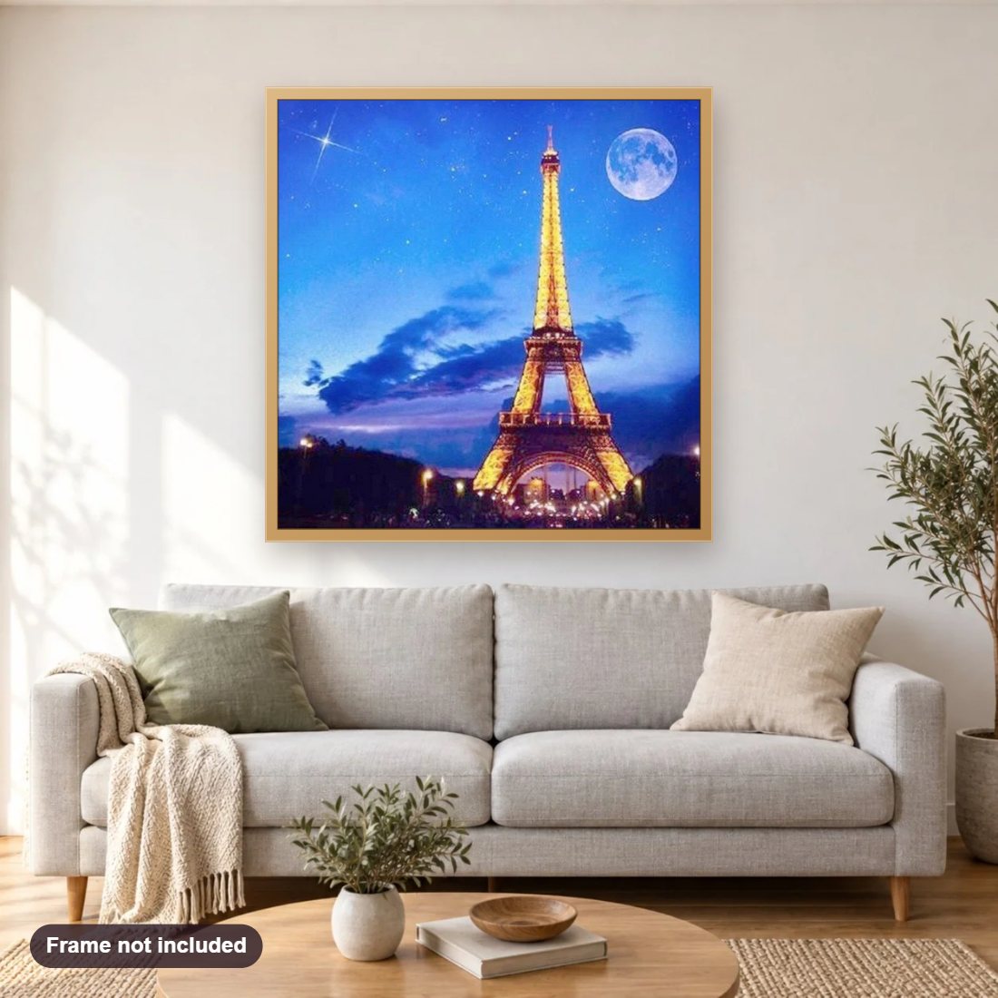 Full Moon & Eiffel Tower View diamond painting shown framed on a living room wall above a sofa