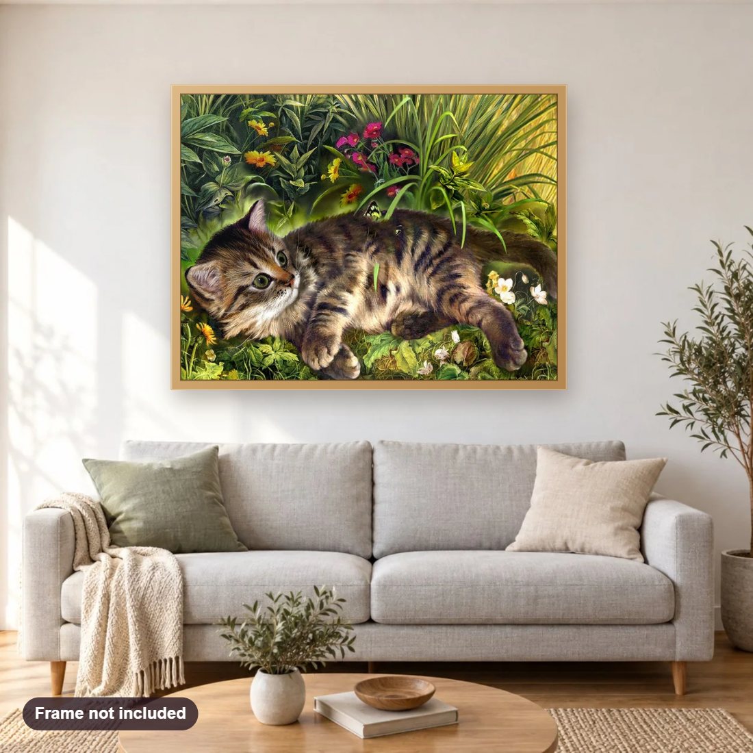 Garden Cat diamond painting shown framed on a living room wall above a sofa