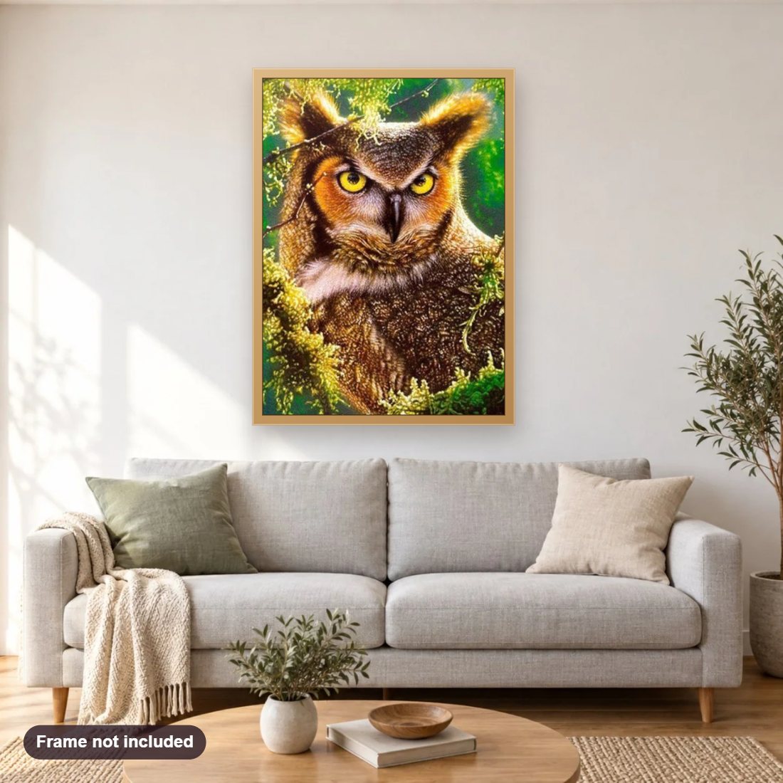 Gazing Owl diamond painting shown framed on a living room wall above a sofa
