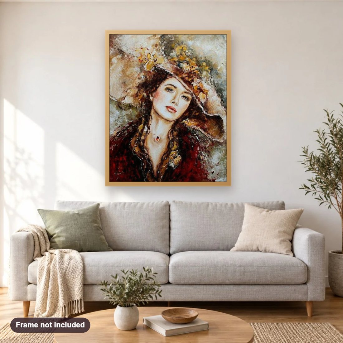 Girl in Beautiful Hat diamond painting shown framed on a living room wall above a sofa