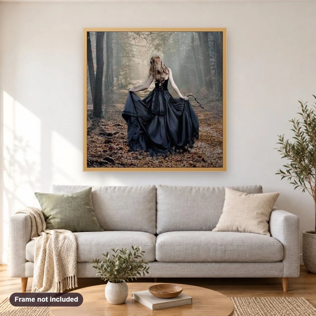 Girl in Black Ball Gown diamond painting shown framed on a living room wall above a sofa