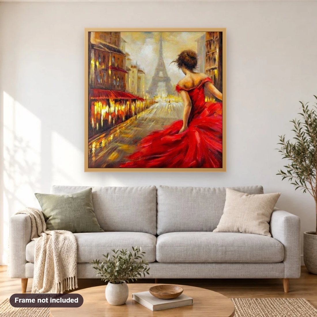 Girl in Red Dress & Eiffel Tower diamond painting shown framed on a living room wall above a sofa
