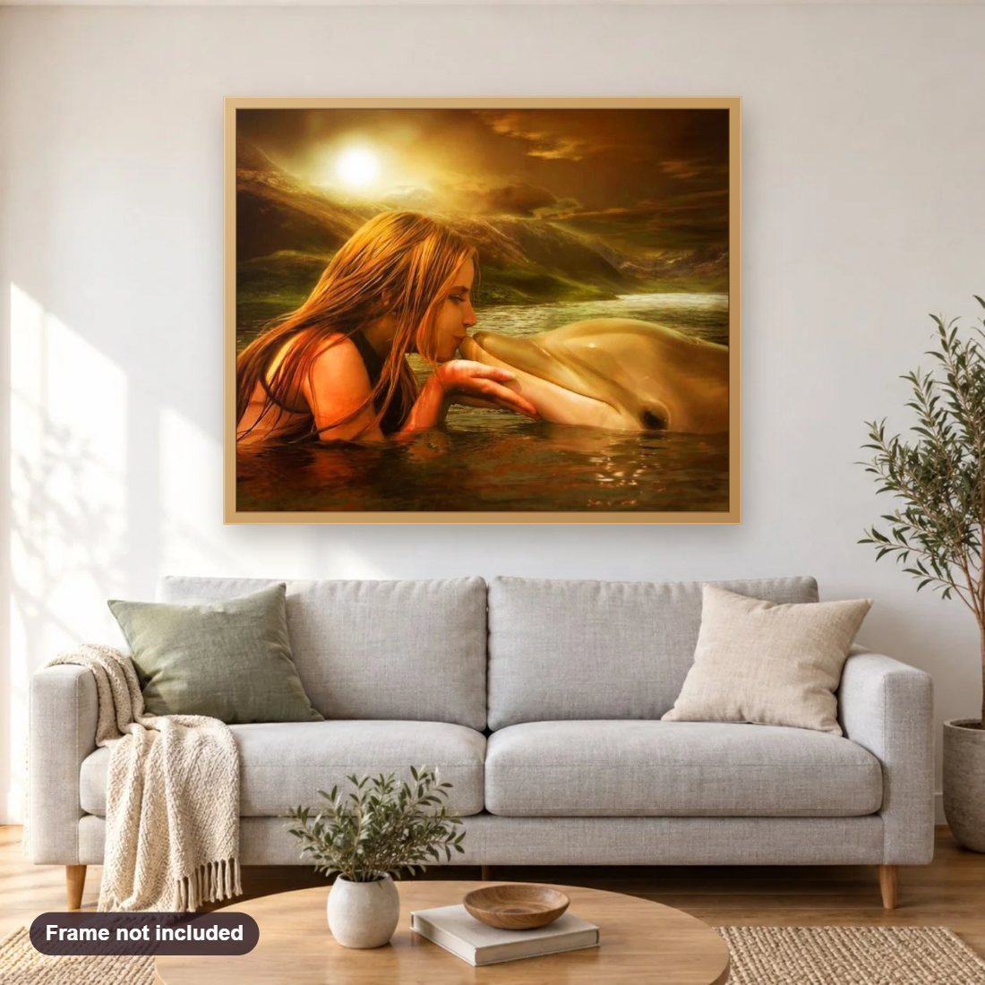 Girl Kissing the Dolphin diamond painting shown framed on a living room wall above a sofa