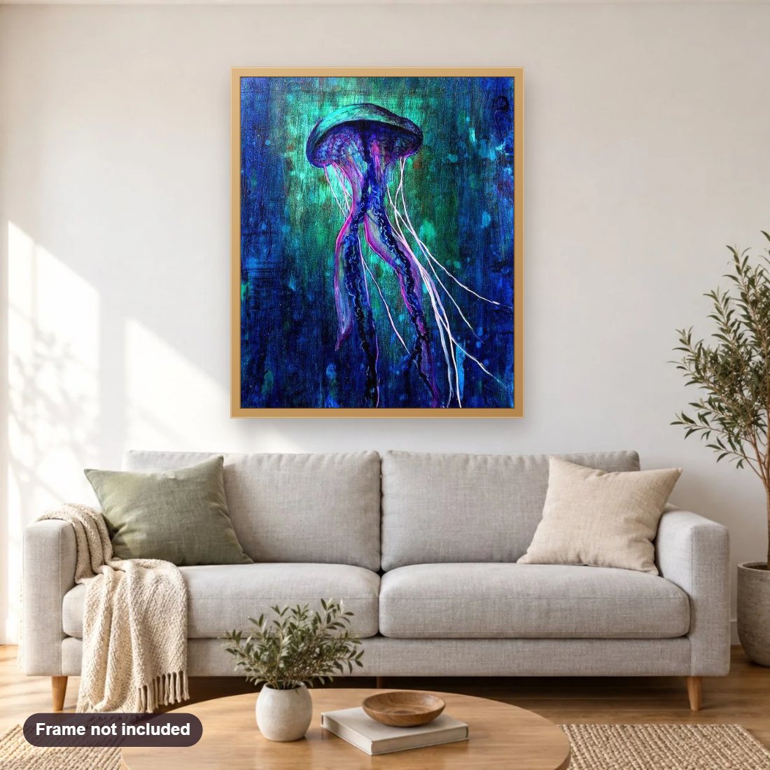 Glow in the Dark Jellyfish diamond painting shown framed on a living room wall above a sofa