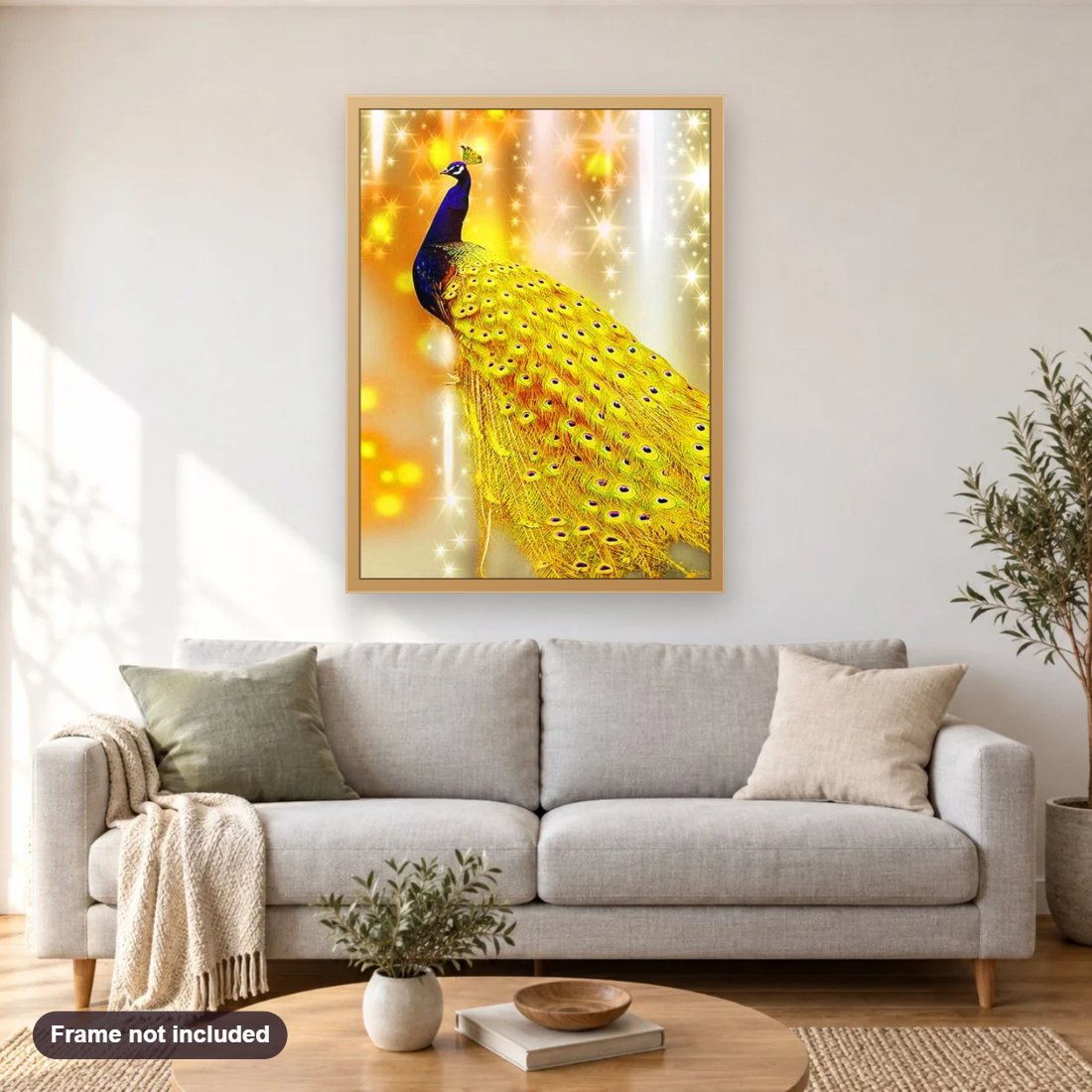 Golden Peacock diamond painting shown framed on a living room wall above a sofa