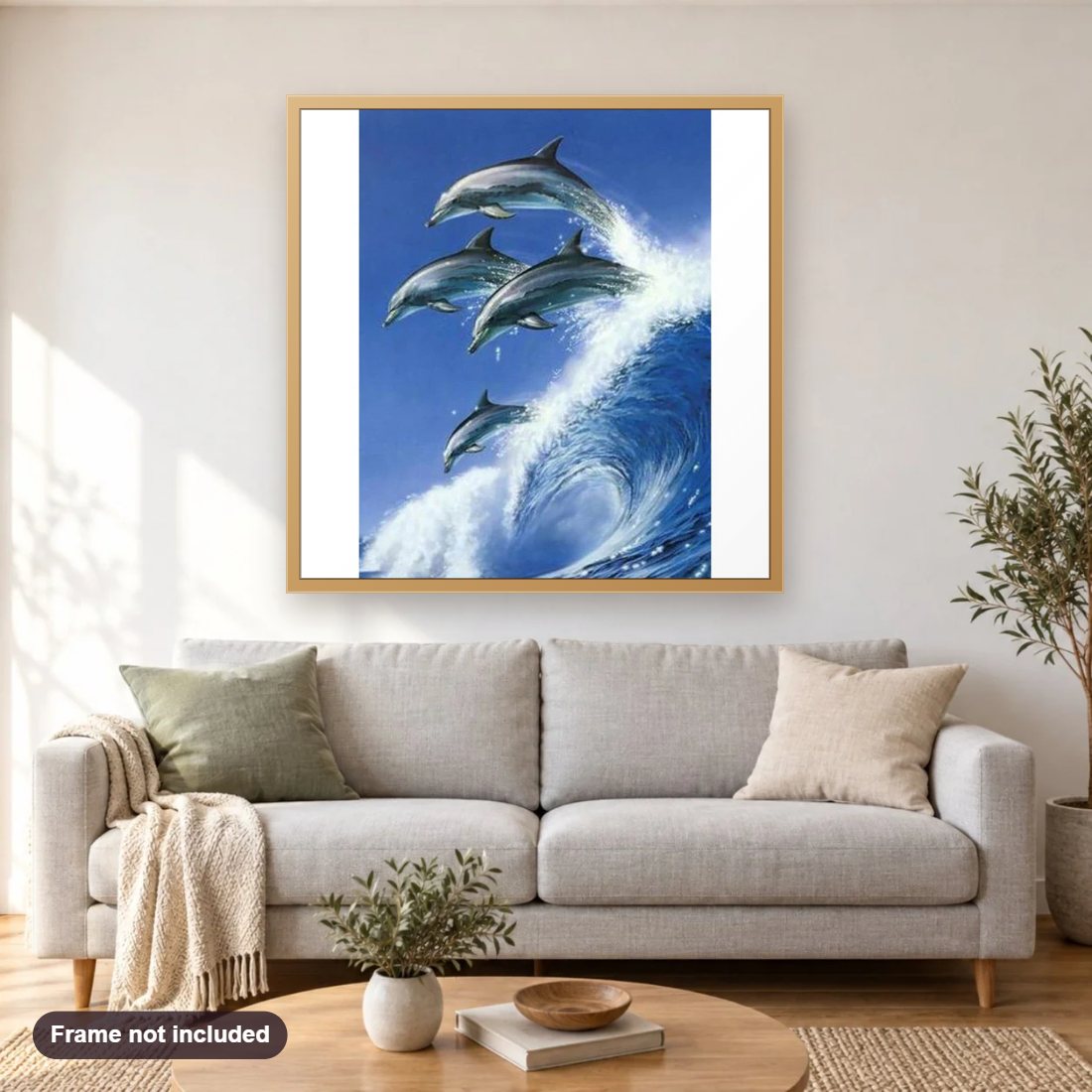 Gorgeous Dolphins diamond painting shown framed on a living room wall above a sofa