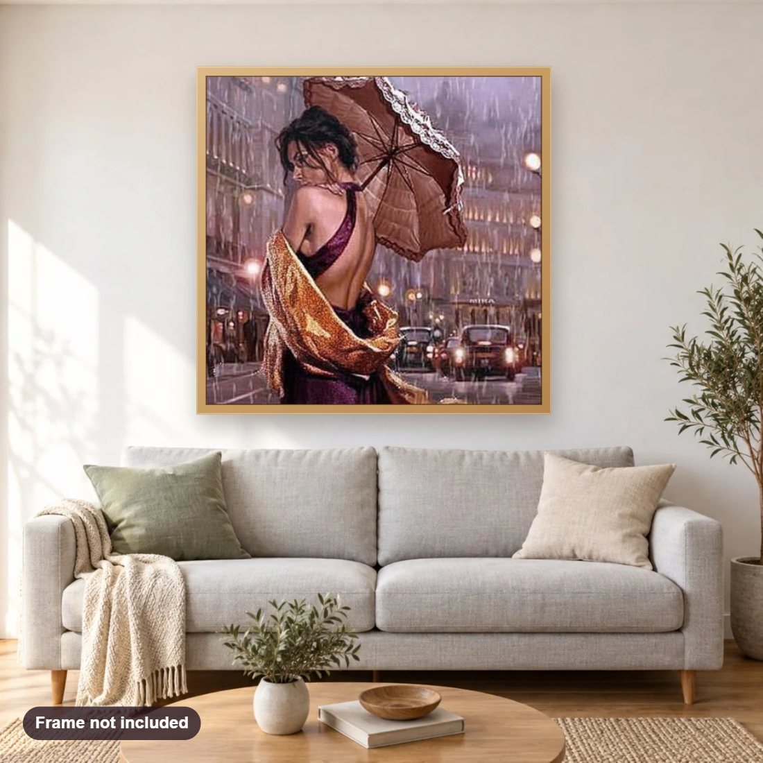 Gorgeous Girl with Umbrella diamond painting shown framed on a living room wall above a sofa