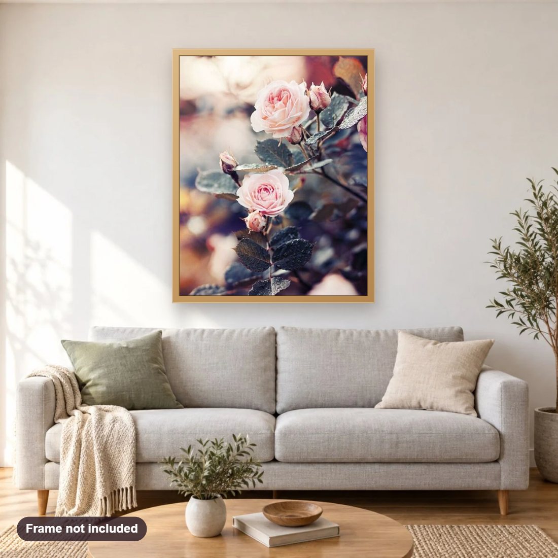 Gorgeous Pink Rose Plant diamond painting shown framed on a living room wall above a sofa