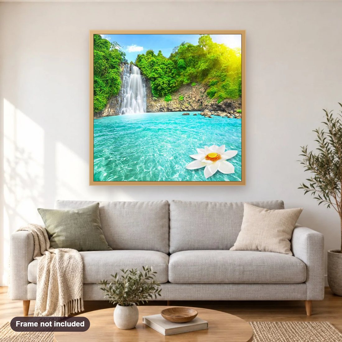 Green Trees & Beautiful Waterfall diamond painting shown framed on a living room wall above a sofa