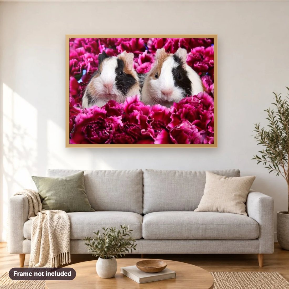 Guinea pigs & Flowers diamond painting shown framed on a living room wall above a sofa