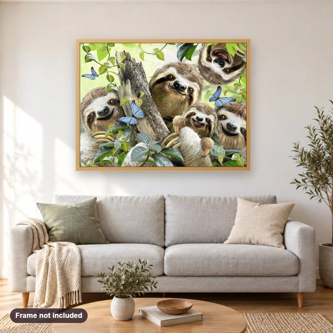 Happy Sloth Family diamond painting shown framed on a living room wall above a sofa