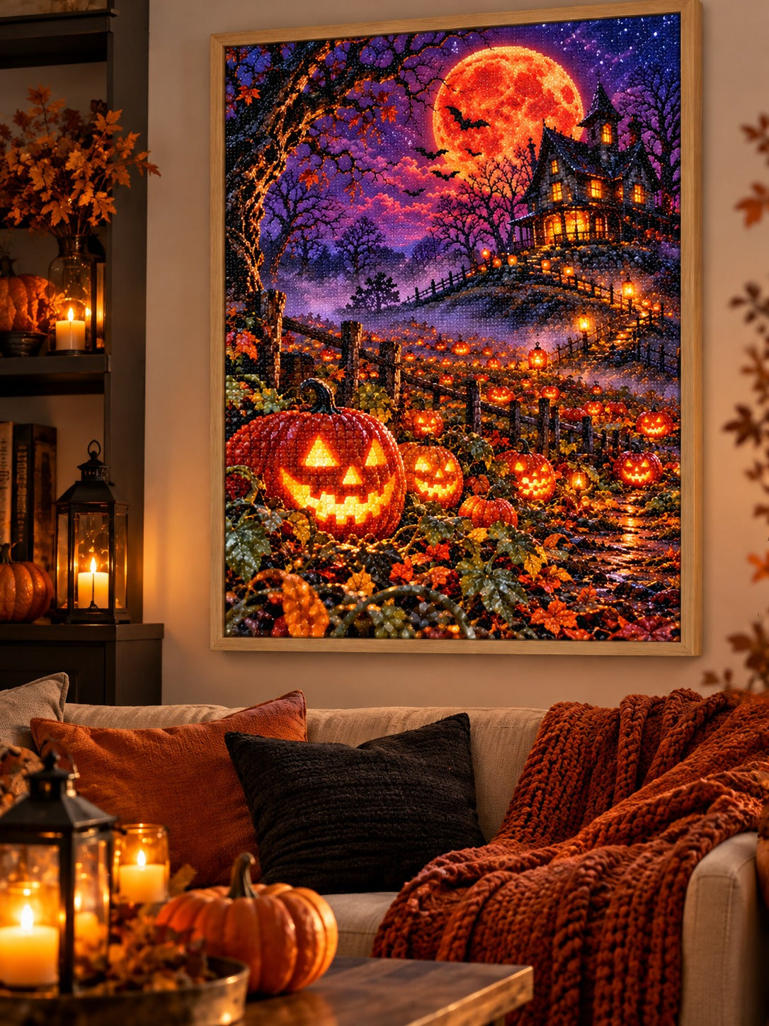 Finished haunted pumpkin patch under a blood moon diamond painting in a light oak frame hanging in a cozy living room decorated for autumn and Halloween