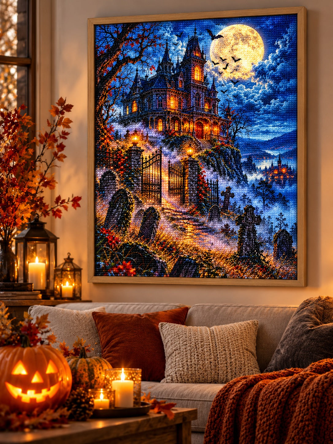 Finished haunted Victorian mansion on a foggy hill at midnight diamond painting in a light oak frame hanging in a cozy living room decorated for autumn and Halloween